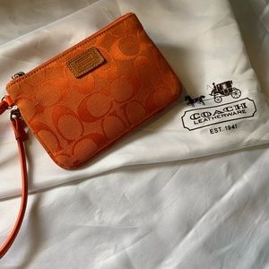 orange coach wristlet